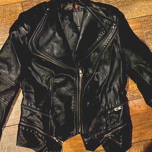 Brand new, never worn, leather motorcycle jacket.